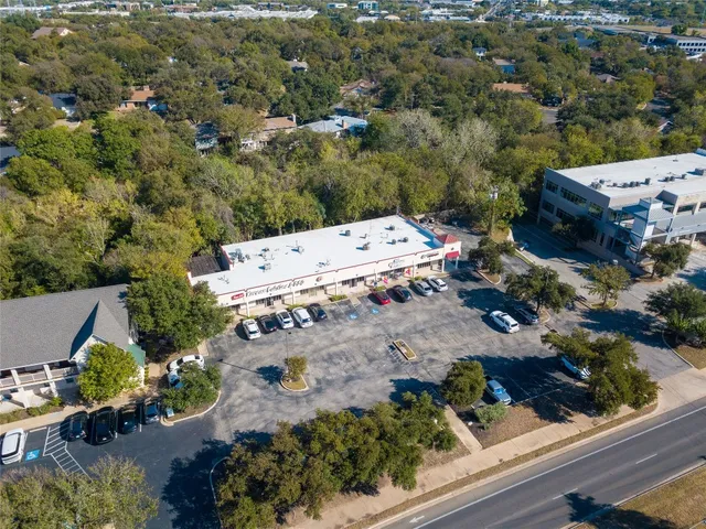 an aerial view of house with yard