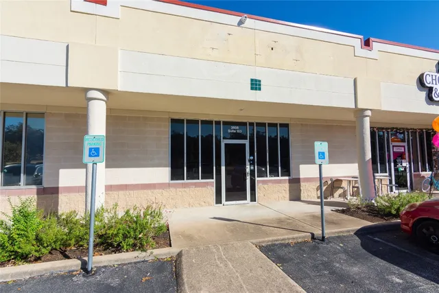 a front view of a building with street