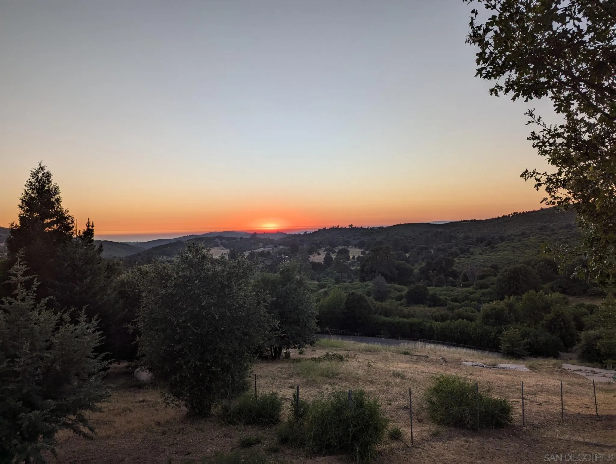 a view of a street with mountains in the background