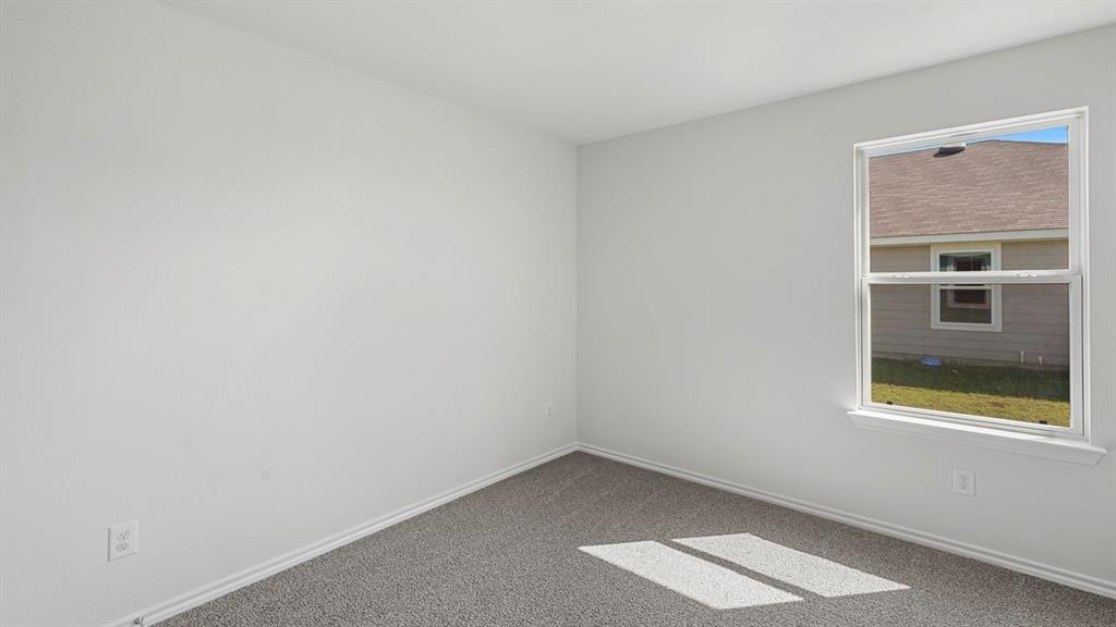 628 Dunham Road Farmersville, TX 75442 - Photo 12 of 36 Neutral wall paint with carpet flooring