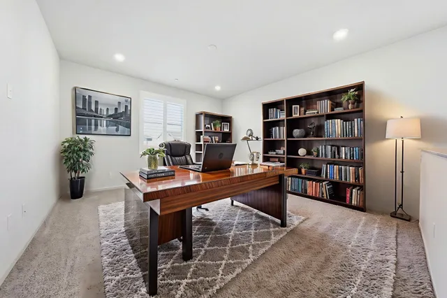 a view of a workspace with furniture