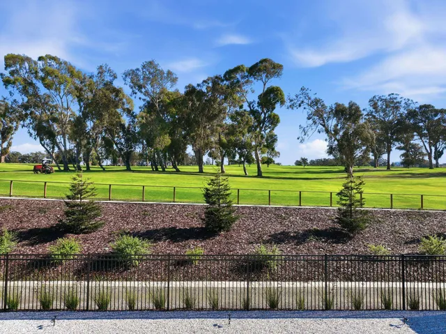 an aerial view of a house with a yard basket ball court and outdoor seating