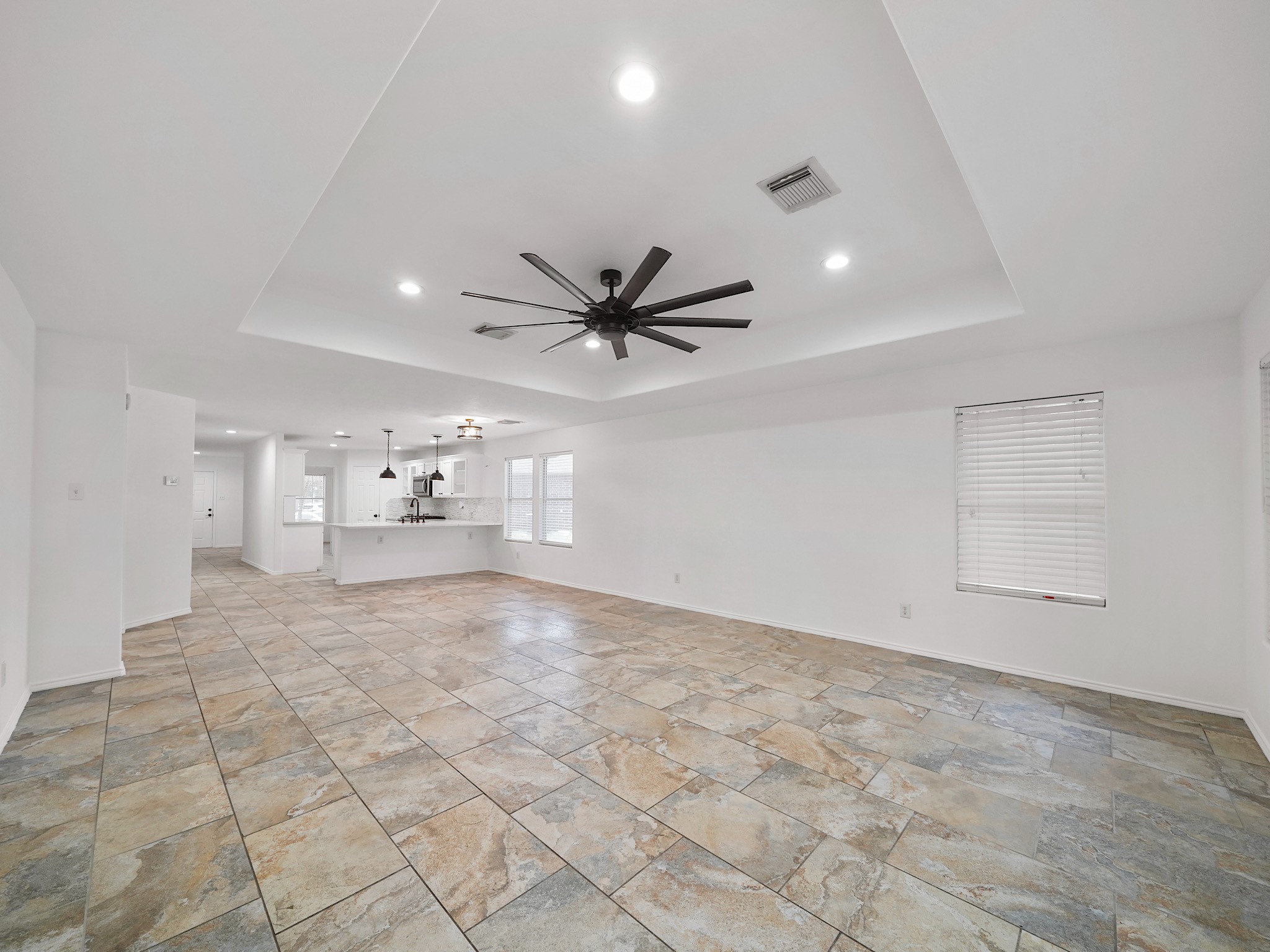 1011 Backland Court Spring, TX 77373 - Photo 4 of 19 Main living area downstairs, open to kitchen. High Ceilings with Tray ceiling.