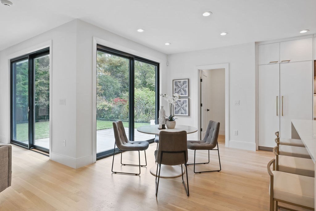 108 Bradford Street Needham, MA 02492 - Photo 12 of 42 a dining room with furniture and a floor to ceiling window