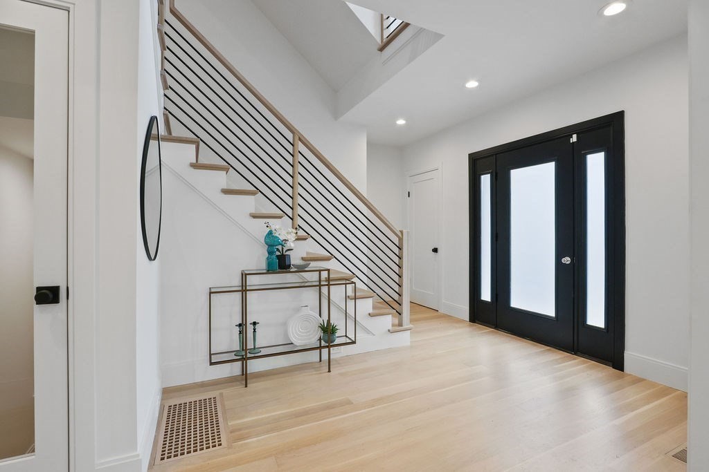 108 Bradford Street Needham, MA 02492 - Photo 21 of 42 en view interior of a house with wooden floor and stairs