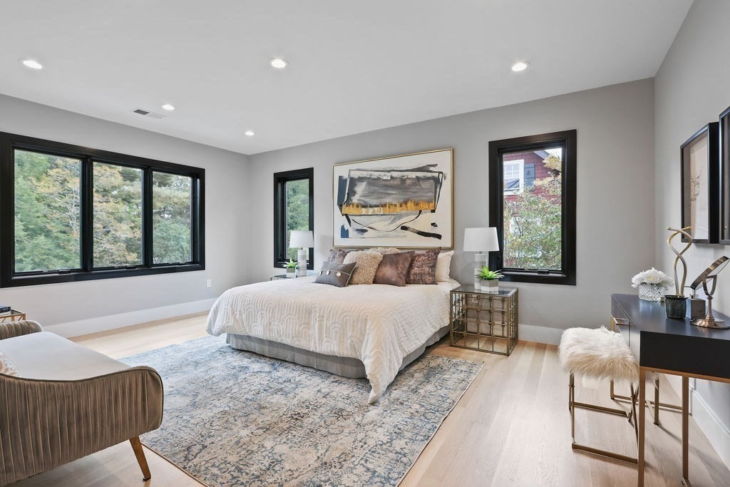 108 Bradford Street Needham, MA 02492 - Photo 22 of 42 a bedroom with a large bed and a large window