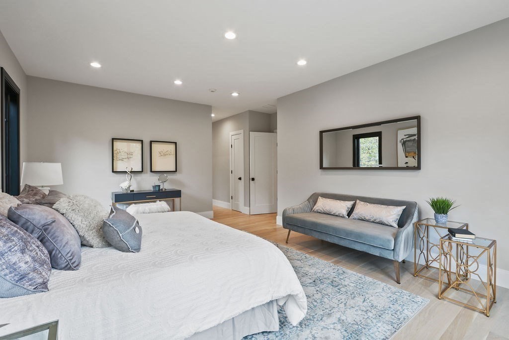 108 Bradford Street Needham, MA 02492 - Photo 23 of 42 a bedroom with a bed and a couch