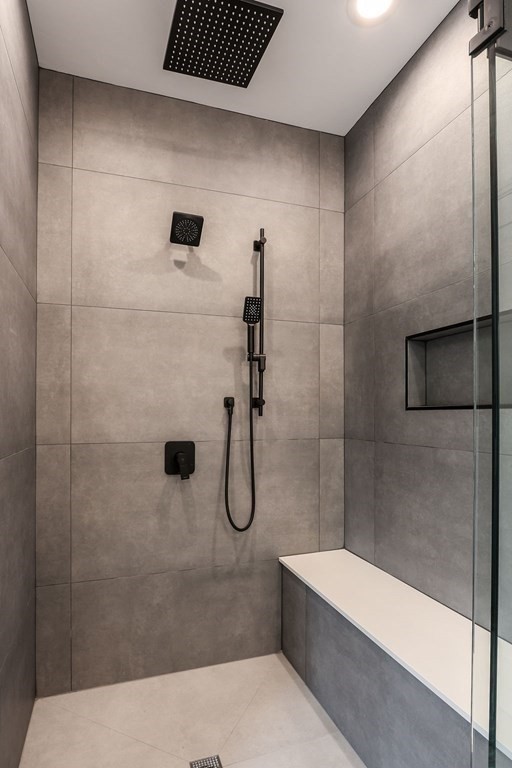 108 Bradford Street Needham, MA 02492 - Photo 26 of 42 a bathroom with a bathtub and shower