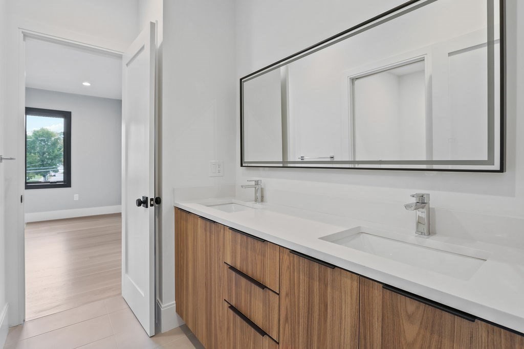 108 Bradford Street Needham, MA 02492 - Photo 29 of 42 a bathroom with a sink and a mirror