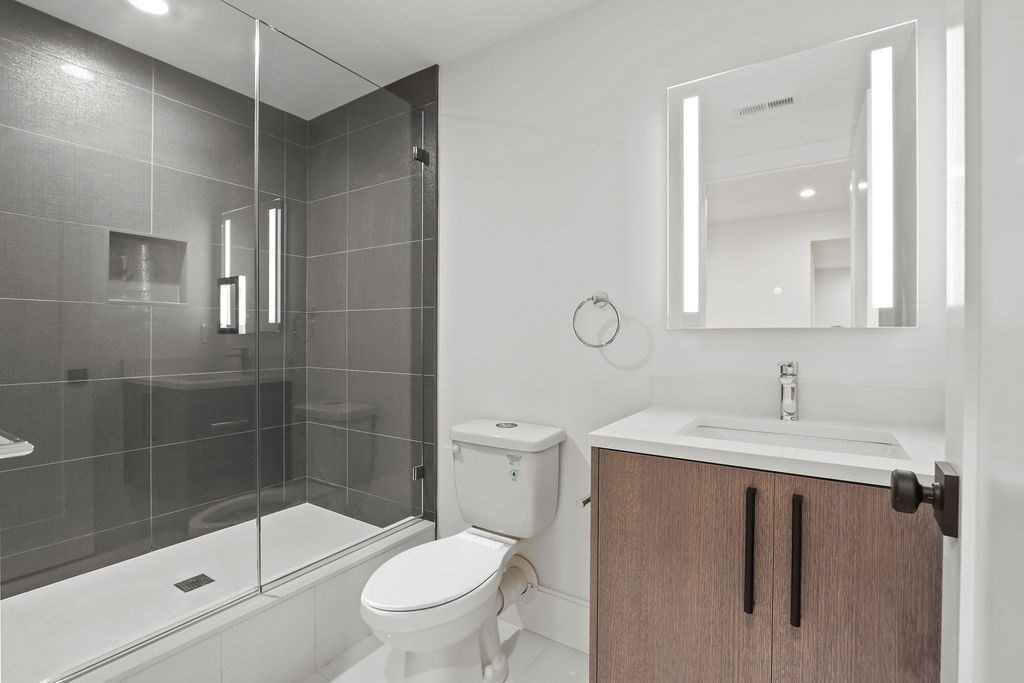 108 Bradford Street Needham, MA 02492 - Photo 30 of 42 a bathroom with a sink toilet and shower