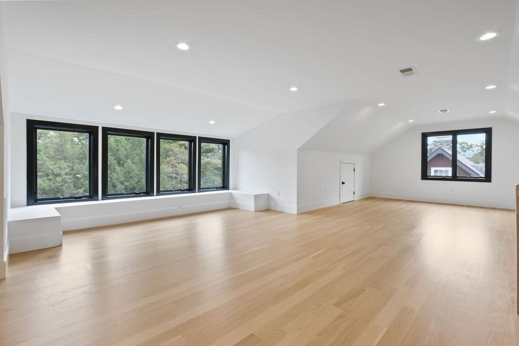 108 Bradford Street Needham, MA 02492 - Photo 34 of 42 a view of an empty room with wooden floor and a window