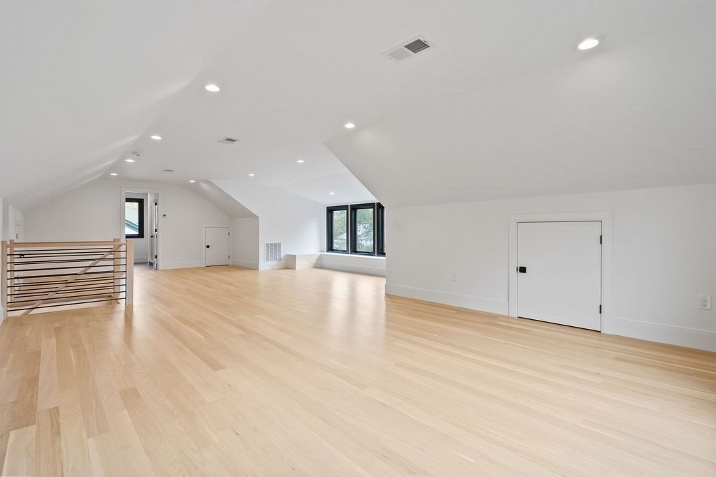 108 Bradford Street Needham, MA 02492 - Photo 35 of 42 a view of an empty room with wooden floor