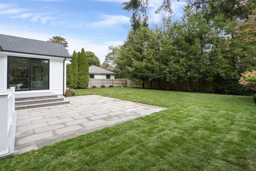 108 Bradford Street Needham, MA 02492 - Photo 37 of 42 a view of a backyard with a garden