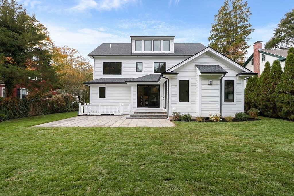 108 Bradford Street Needham, MA 02492 - Photo 38 of 42 a front view of a house with a garden