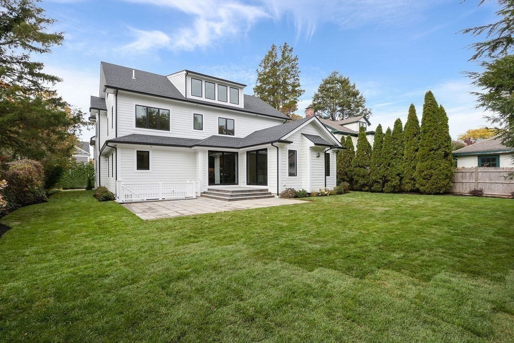108 Bradford Street Needham, MA 02492 - Photo 39 of 42 a view of a yard in front of a house with large trees