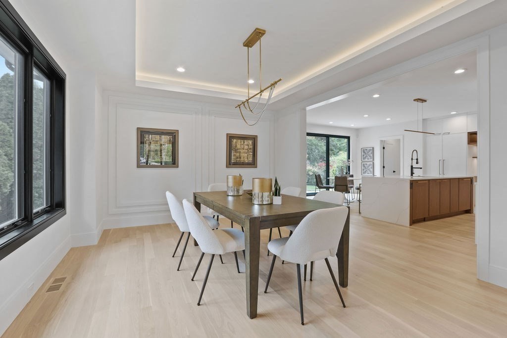 108 Bradford Street Needham, MA 02492 - Photo 8 of 42 a view of a dining room with furniture window and wooden floor