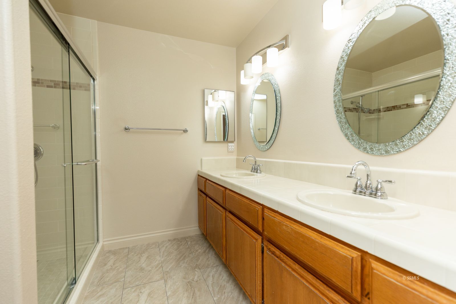 413 Petris Avenue Ridgecrest, CA 93555 - Photo 18 of 30 a bathroom with a double vanity sink and a mirror
