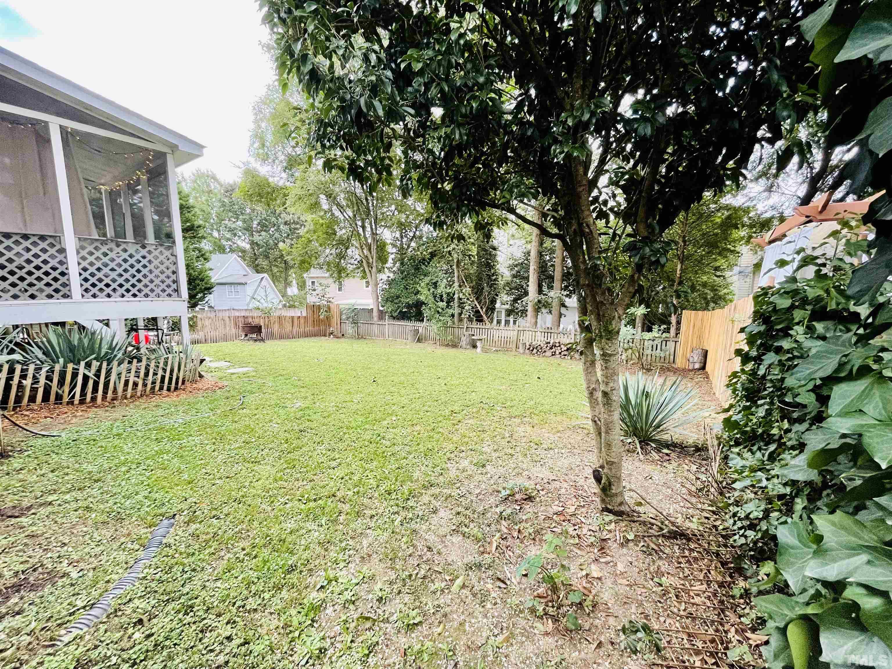 2512 Holbrook Court Raleigh, NC 27604 - Photo 3 of 26 a view of a garden with a bench
