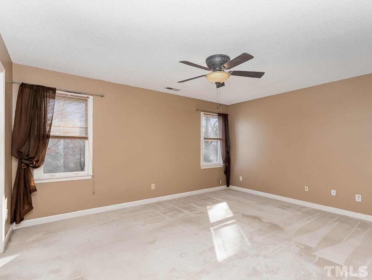 2512 Holbrook Court Raleigh, NC 27604 - Photo 23 of 26 a view of a livingroom with a ceiling fan and window