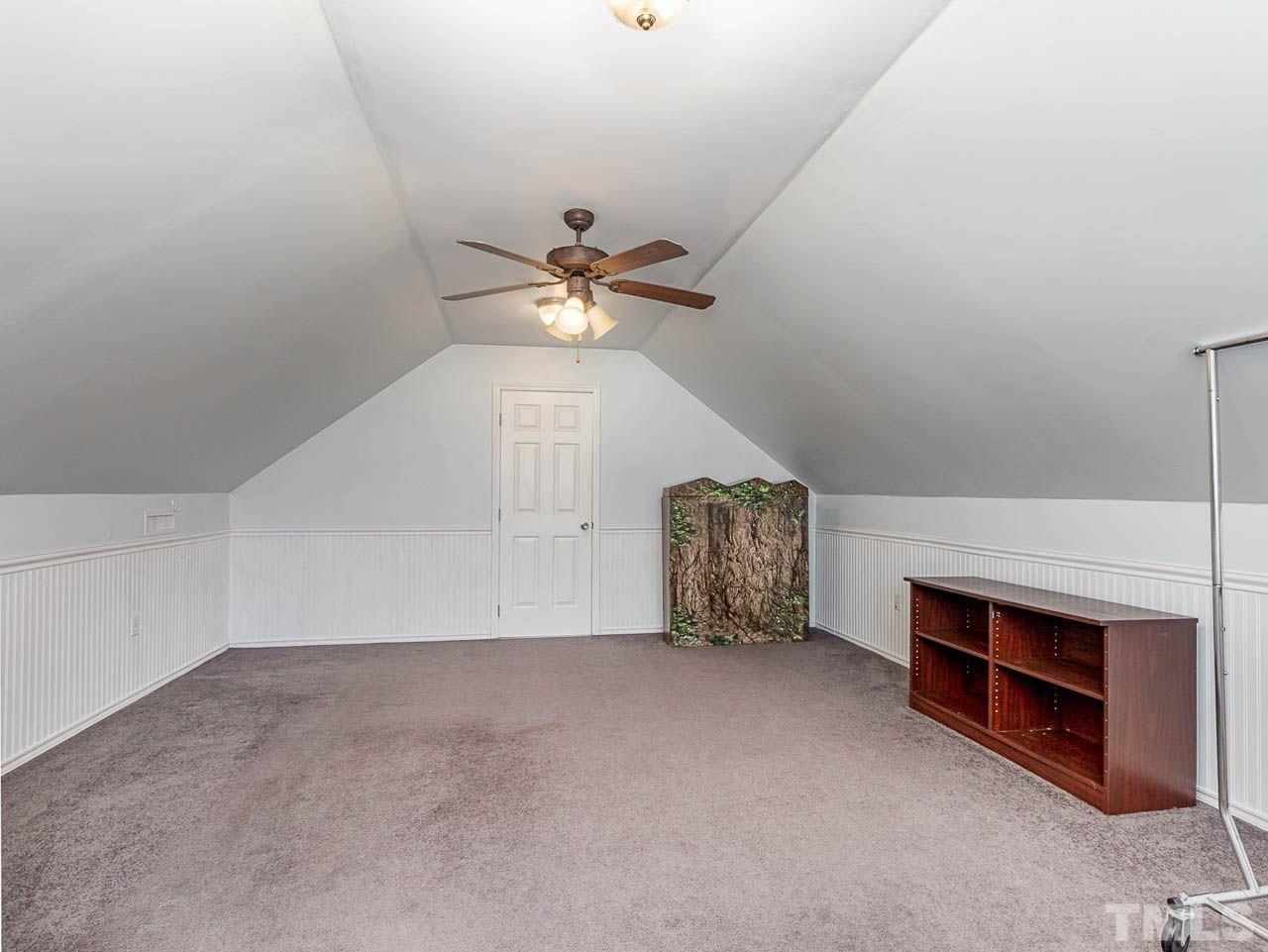 2512 Holbrook Court Raleigh, NC 27604 - Photo 25 of 26 a view of an empty room with a fireplace