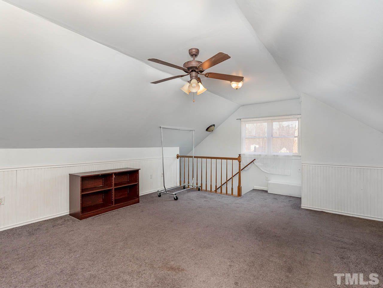 2512 Holbrook Court Raleigh, NC 27604 - Photo 26 of 26 a view of a livingroom with a ceiling fan and window