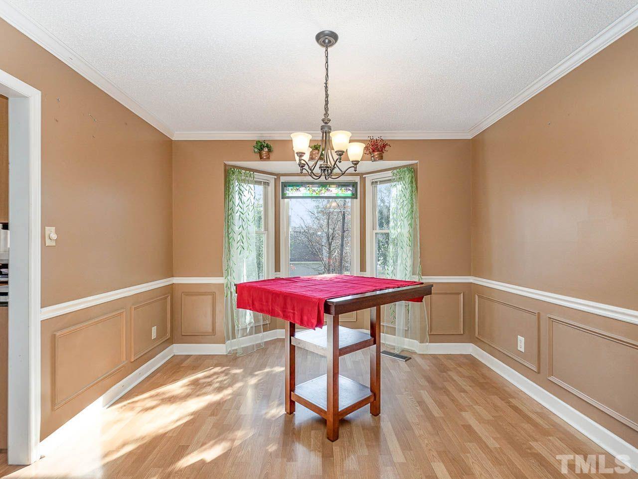 2512 Holbrook Court Raleigh, NC 27604 - Photo 9 of 26 a view of a dining room with furniture window and wooden floor