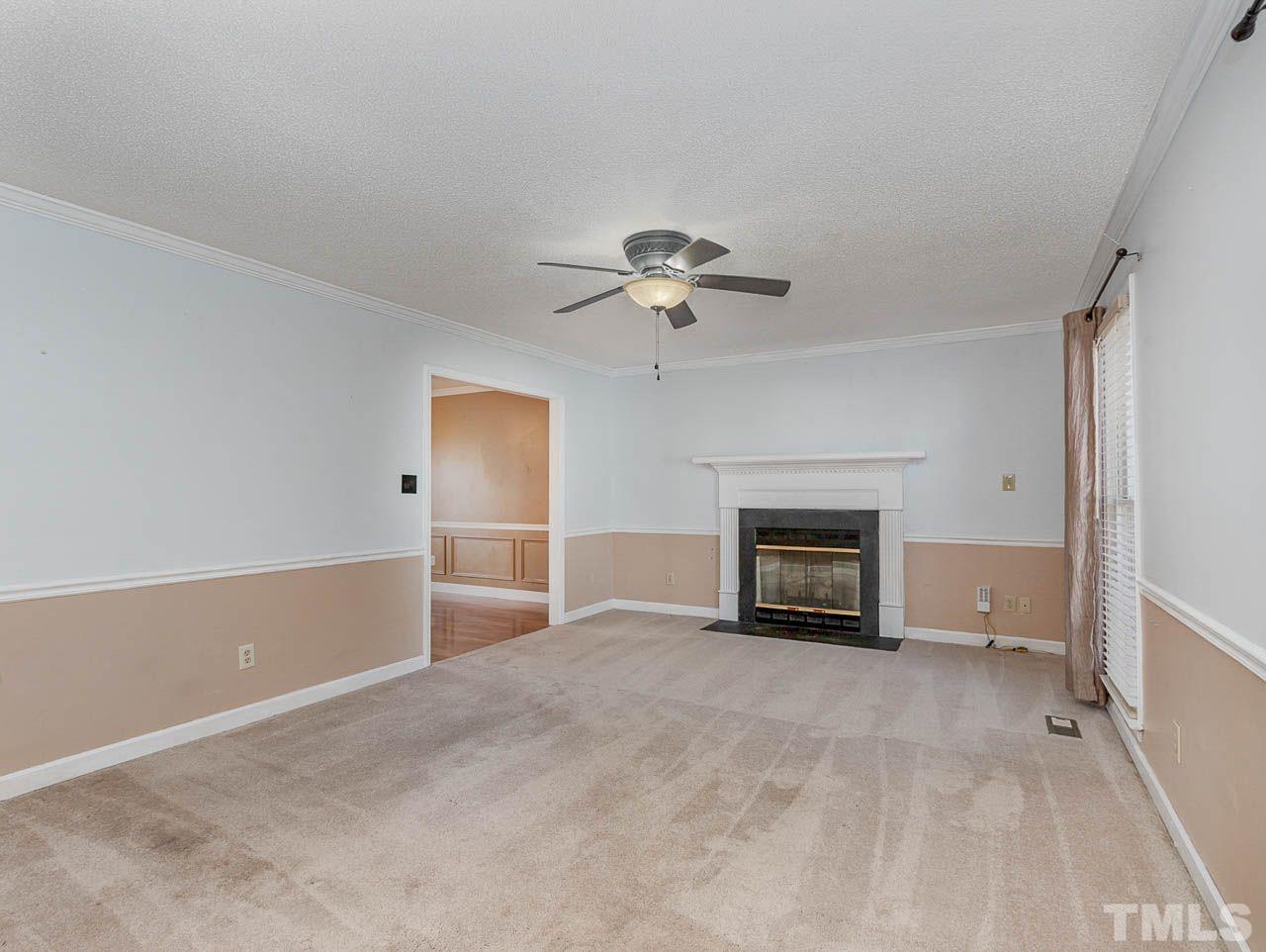 2512 Holbrook Court Raleigh, NC 27604 - Photo 10 of 26 a view of an empty room with a fireplace