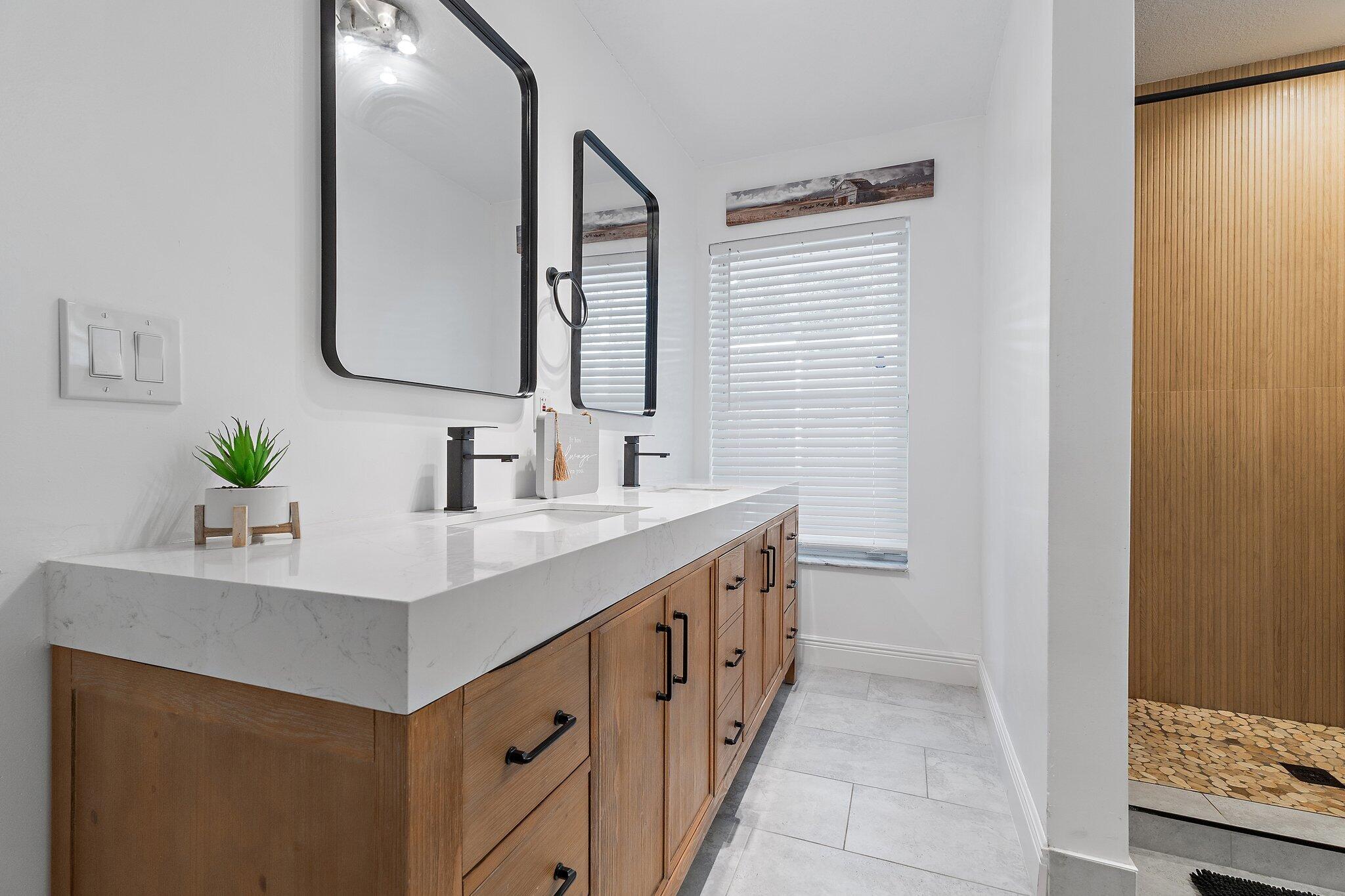 18389 41st Road North Loxahatchee, FL 33470 - Photo 16 of 33 a bathroom with a sink and a mirror