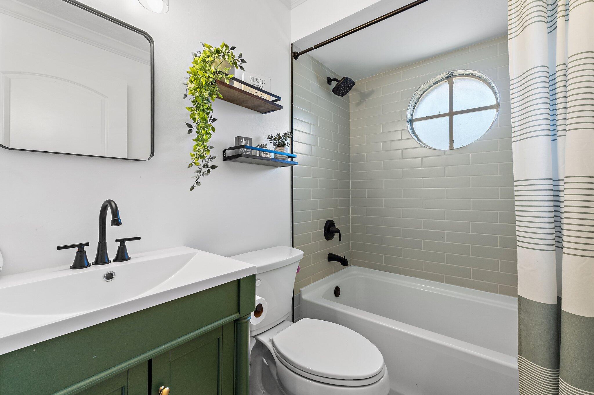 18389 41st Road North Loxahatchee, FL 33470 - Photo 21 of 33 a bathroom with a sink vanity mirror and toilet