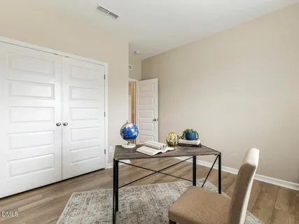 a workspace with furniture and a window