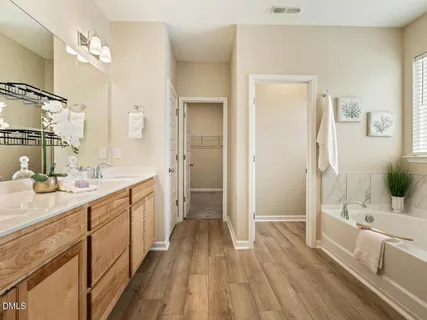a bathroom with a bathtub and a shower