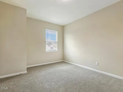 an empty room with closet area