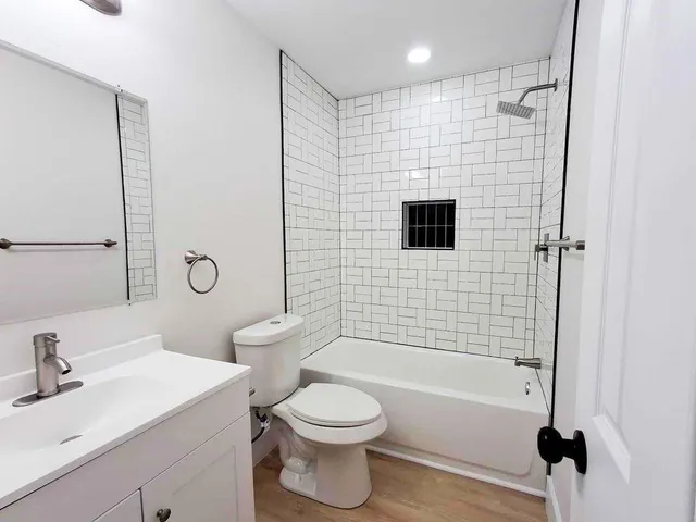 a bathroom with a sink toilet a shower and bathtub