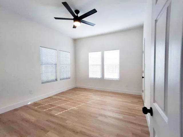 a view of an empty room with a window