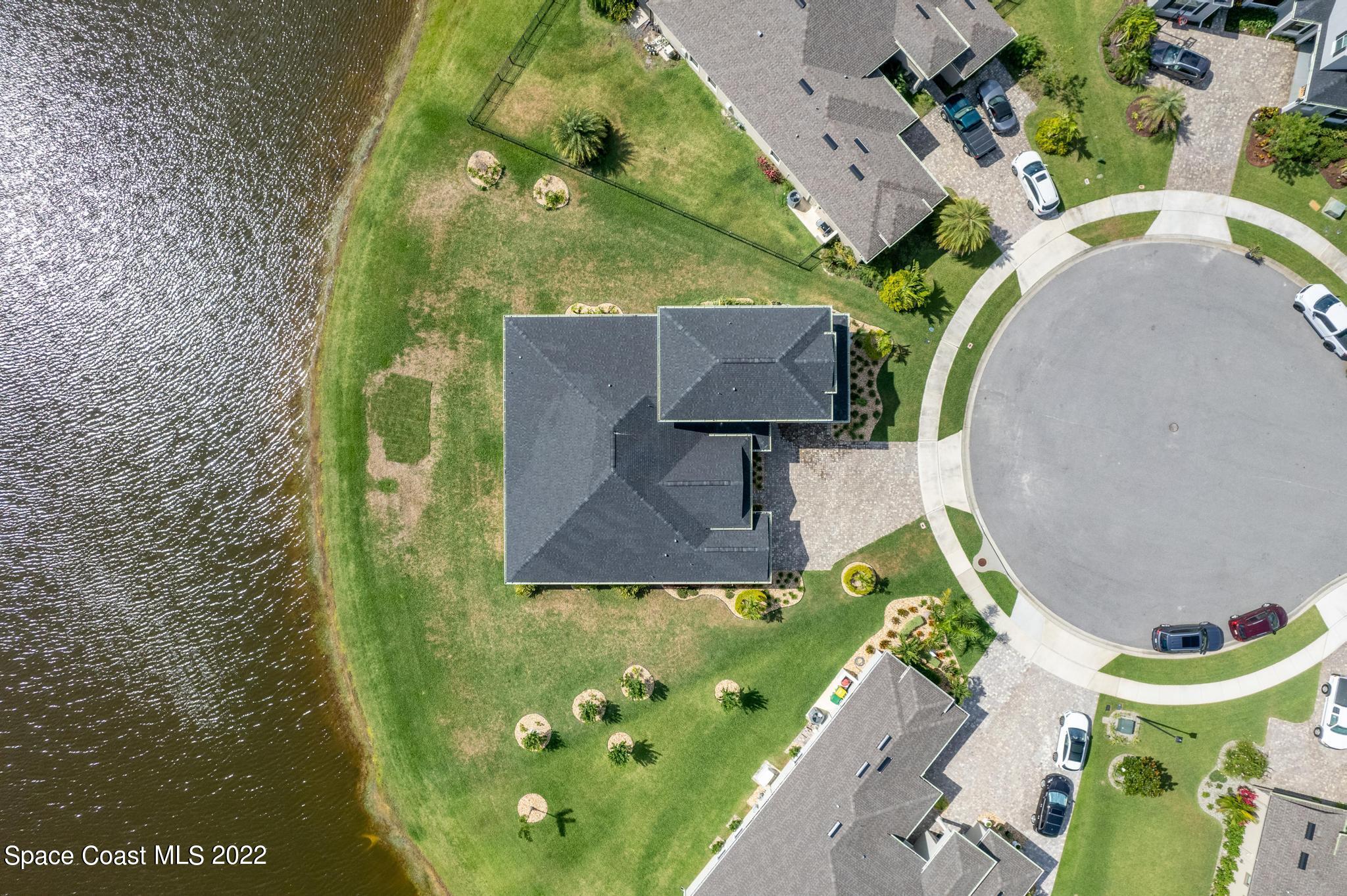 7739 Kerrington Drive Melbourne, FL 32940 - Photo 28 of 35 an aerial view of a swimming pool
