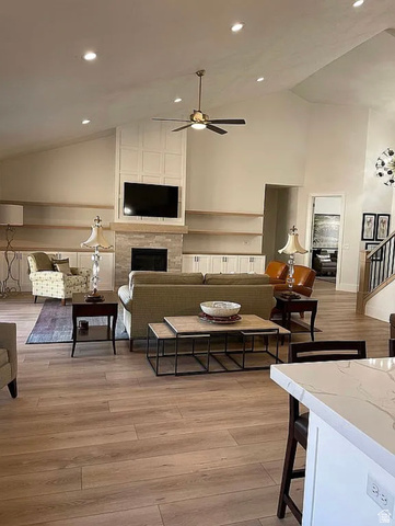 838 East Mountain Road North Ogden, UT 84414 - Photo 4 of 37 Spacious living area featuring wood-finish flooring, a vaulted ceiling with recessed lighting, and a ceiling fan