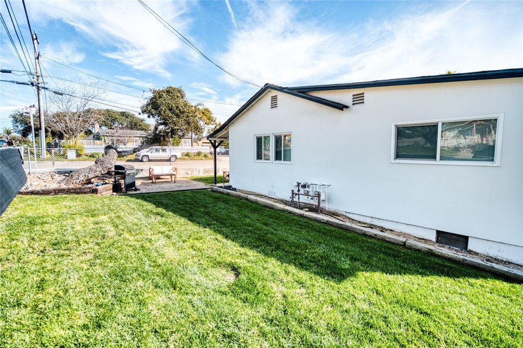261 North 13th Street Grover Beach, CA 93433 - Photo 12 of 46 a view of a backyard with plants and a patio