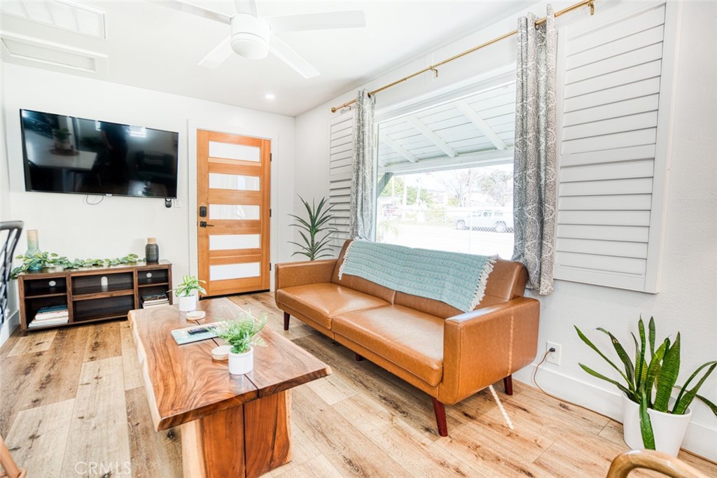261 North 13th Street Grover Beach, CA 93433 - Photo 18 of 46 a living room with furniture and a flat screen tv