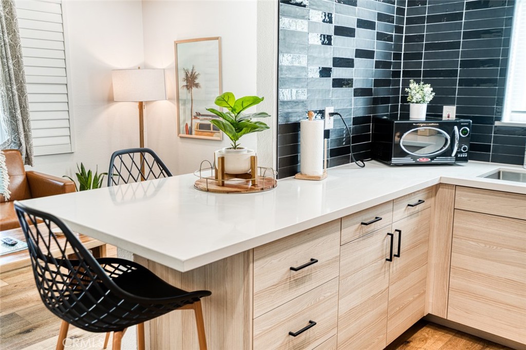 261 North 13th Street Grover Beach, CA 93433 - Photo 20 of 46 a kitchen with a table and chairs in it