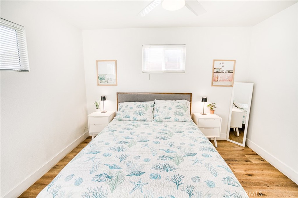 261 North 13th Street Grover Beach, CA 93433 - Photo 21 of 46 a bedroom with a bed and a rug