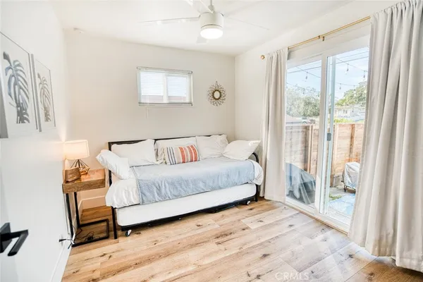 a spacious bedroom with a bed and a window