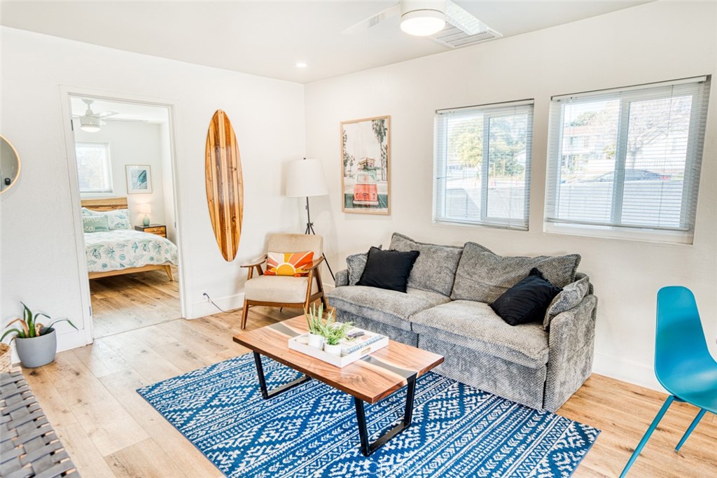 261 North 13th Street Grover Beach, CA 93433 - Photo 32 of 46 a living room with furniture a rug and a large window