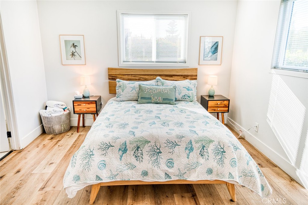 261 North 13th Street Grover Beach, CA 93433 - Photo 35 of 46 a bedroom with a bed and window