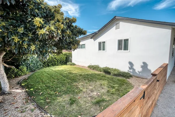 a house view with a backyard space