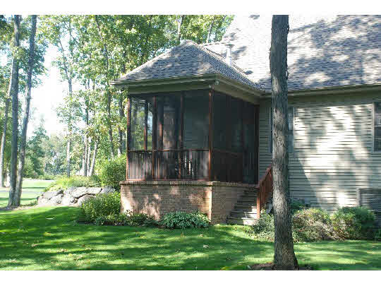 12737 Ashfield Road Caledonia, IL 61011 - Photo 11 of 11 a yellow house with trees in front of it