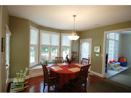 12737 Ashfield Road Caledonia, IL 61011 - Photo 3 of 11 a view of a dining room with furniture window and wooden floor