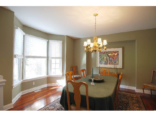 12737 Ashfield Road Caledonia, IL 61011 - Photo 5 of 11 a dining room with furniture a chandelier and a window