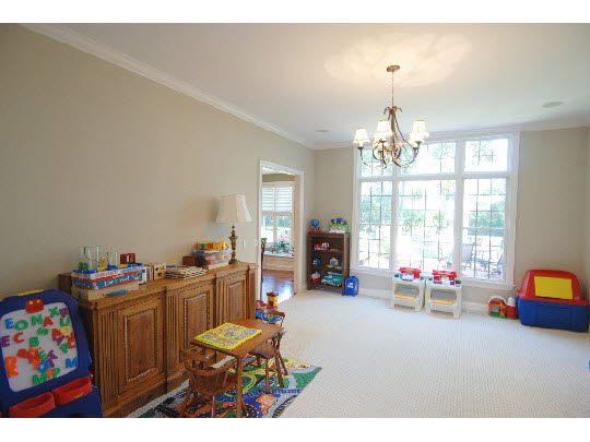 12737 Ashfield Road Caledonia, IL 61011 - Photo 7 of 11 a room with furniture and a chandelier