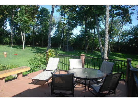12737 Ashfield Road Caledonia, IL 61011 - Photo 10 of 11 a view of a table and chairs in the garden
