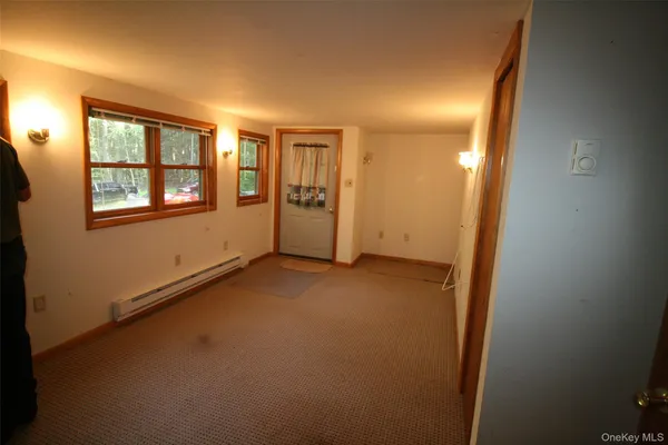 a view of an empty room with a window